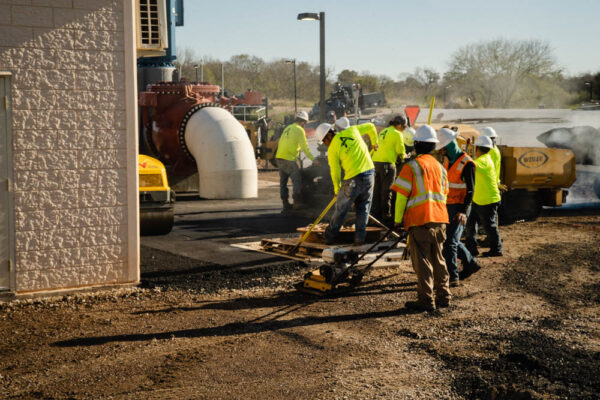 AAA Paving workers work on soil stabilization before they lay new asphalt.